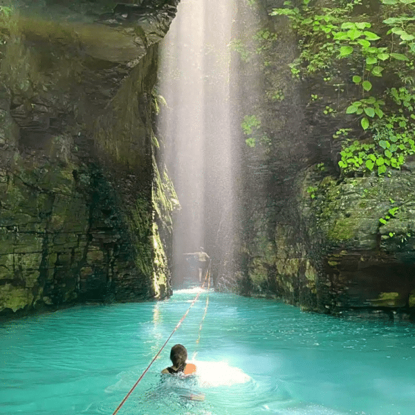 swim through a canyon on the la leona waterfall hike